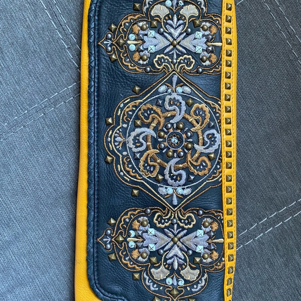 Isabella Fiore mustard and black clutch with black shoulder strap. GUC!
